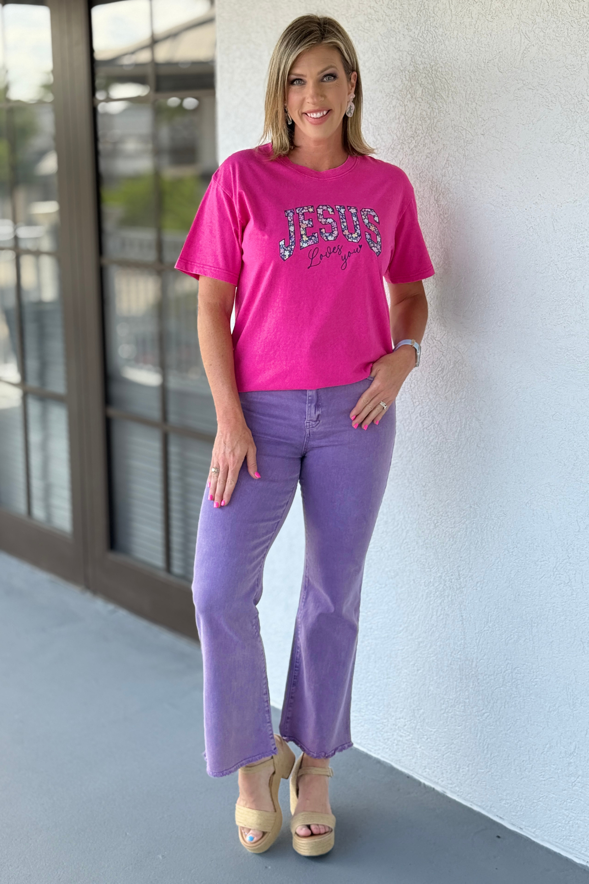 Woman wearing purple wide leg boutique jeans