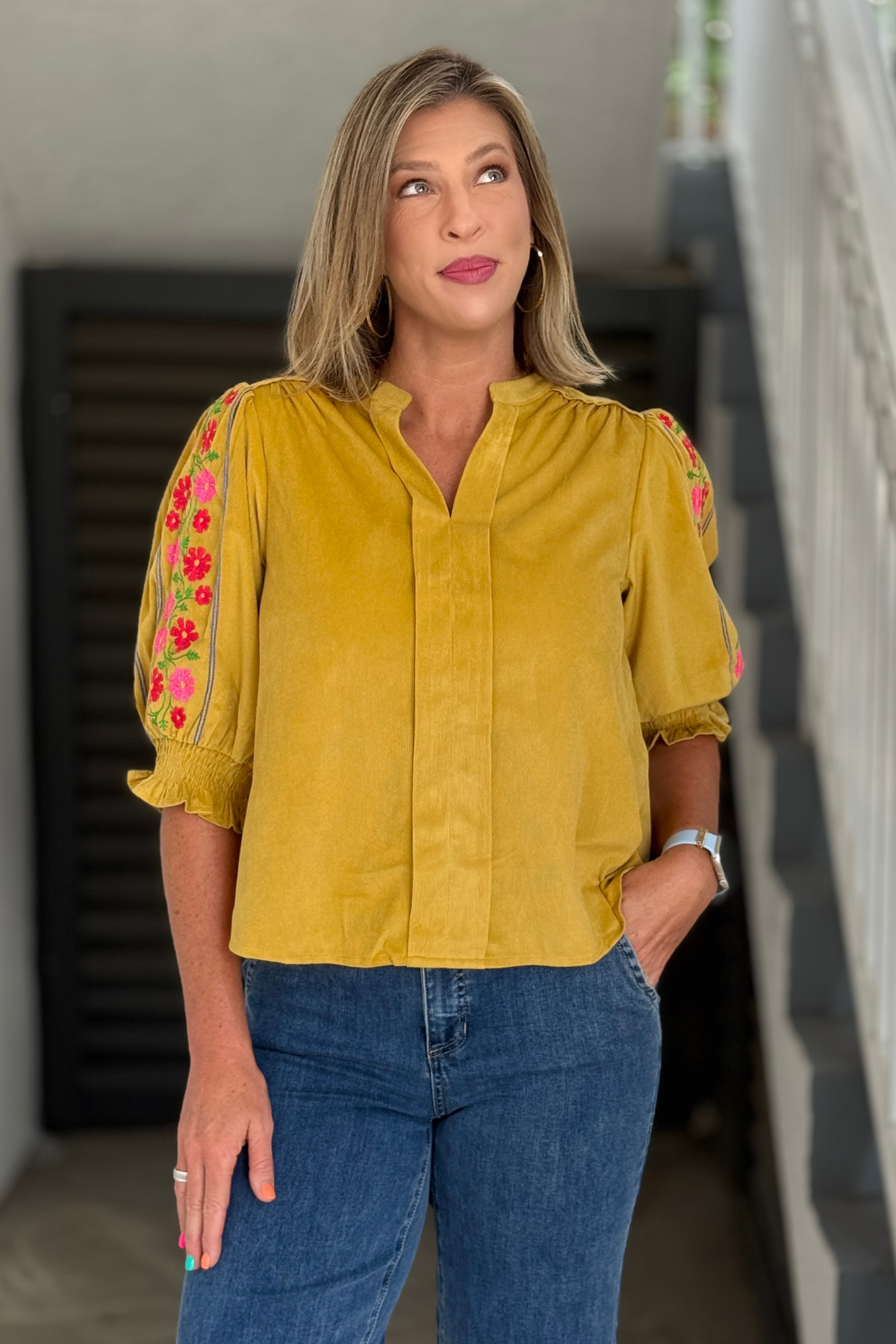 Mustard corduroy blouse with pink floral embroidered sleeves