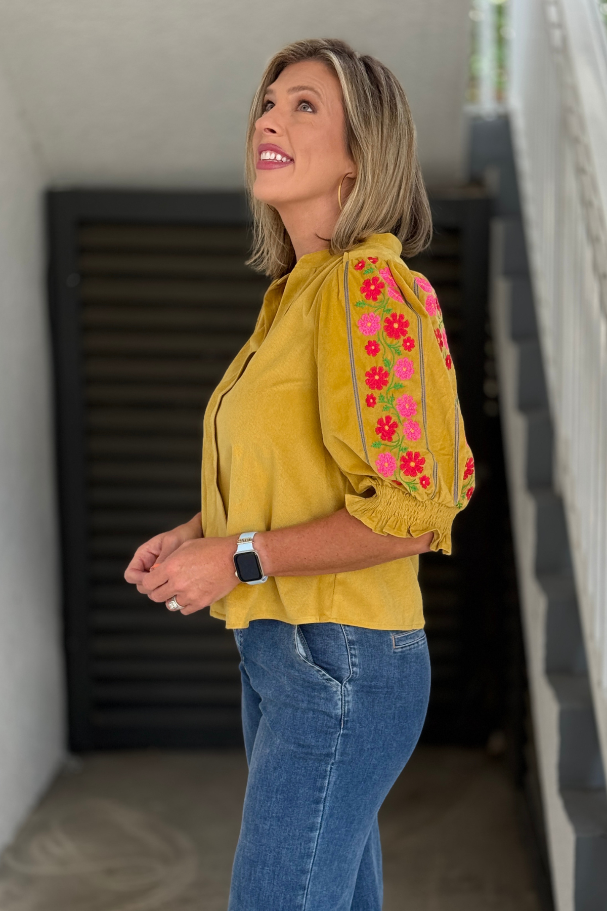 Marigold floral embroidered top side view