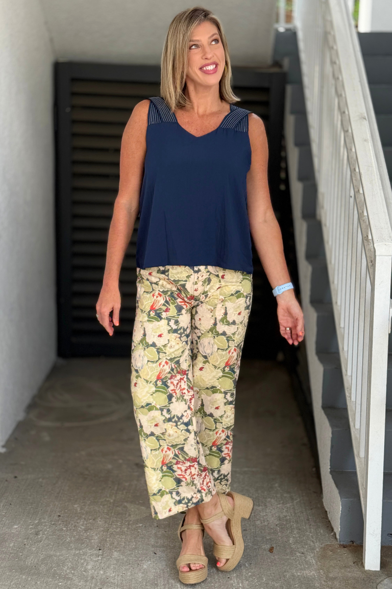 Olive print pants styled with navy sleeveless top