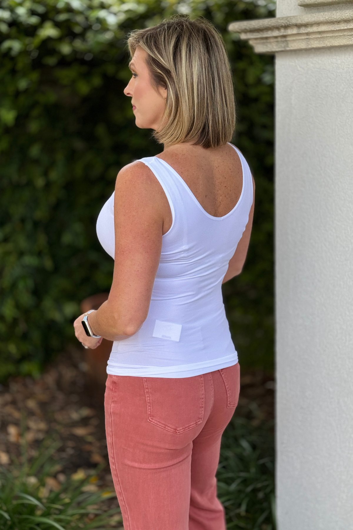 Stretchy seamless tank styled with colored denim