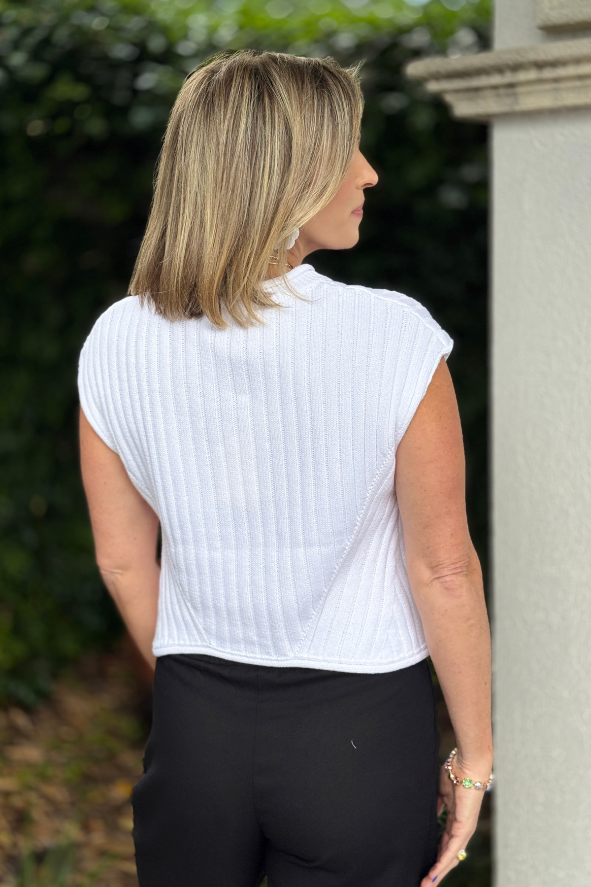 Back view of lightweight ribbed knit tee in off white