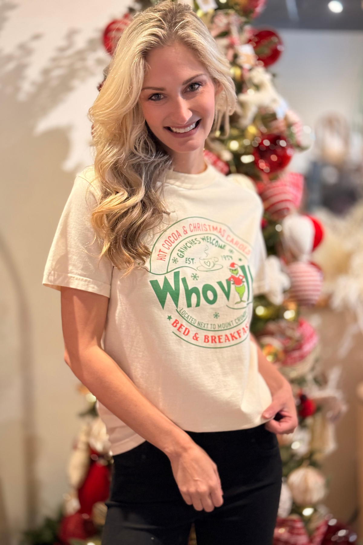 Model wearing Whoville Holiday Bed & Breakfast Tee ivory Christmas shirt