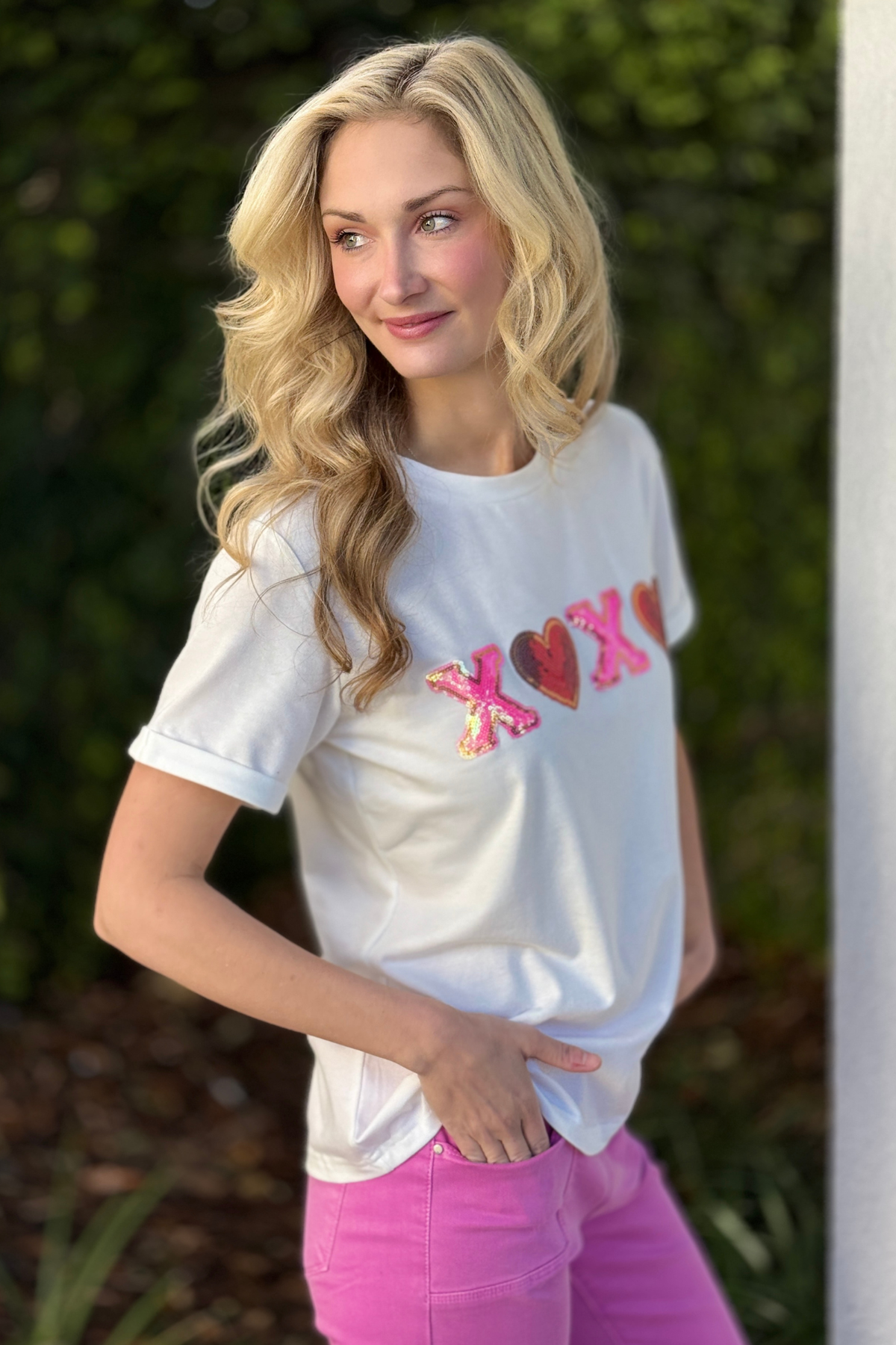 Boutique Valentine XOXO graphic tee styled with pink pants