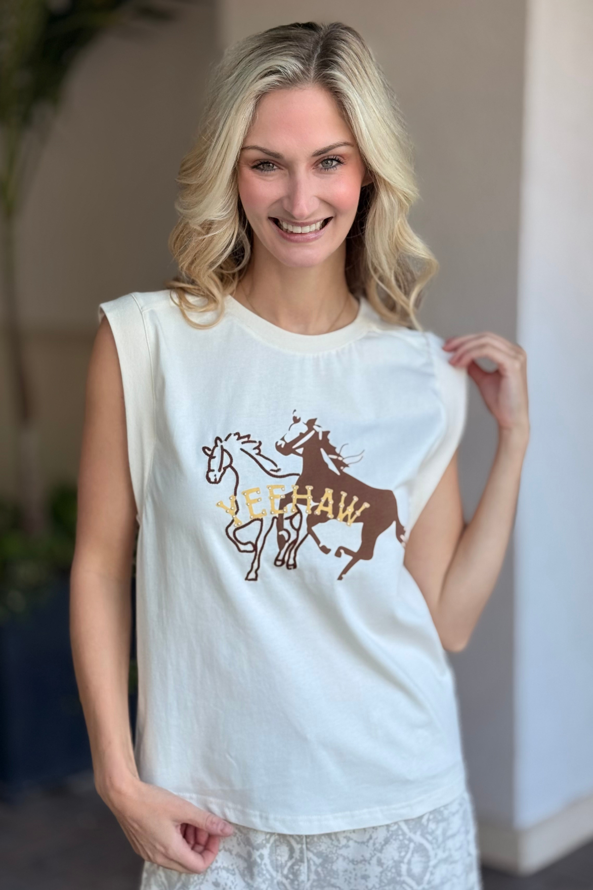 Sleeveless western graphic tank with Yeehaw embroidered detail – front close-up