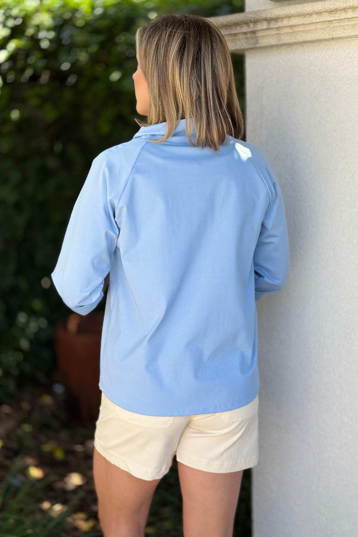 modern asymmetrical top styled with shorts