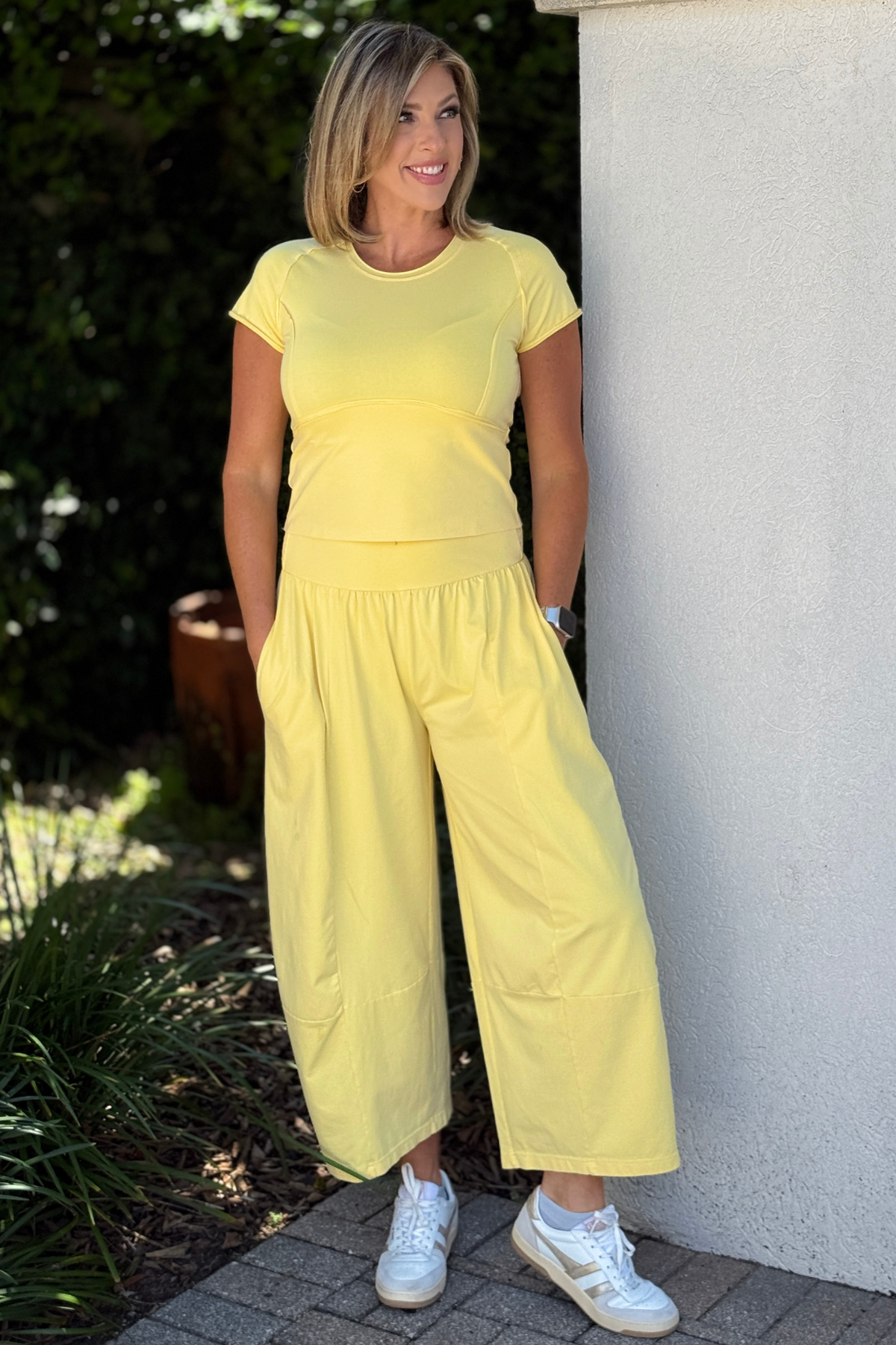 Relaxed fit yellow wide leg pants styled with matching top