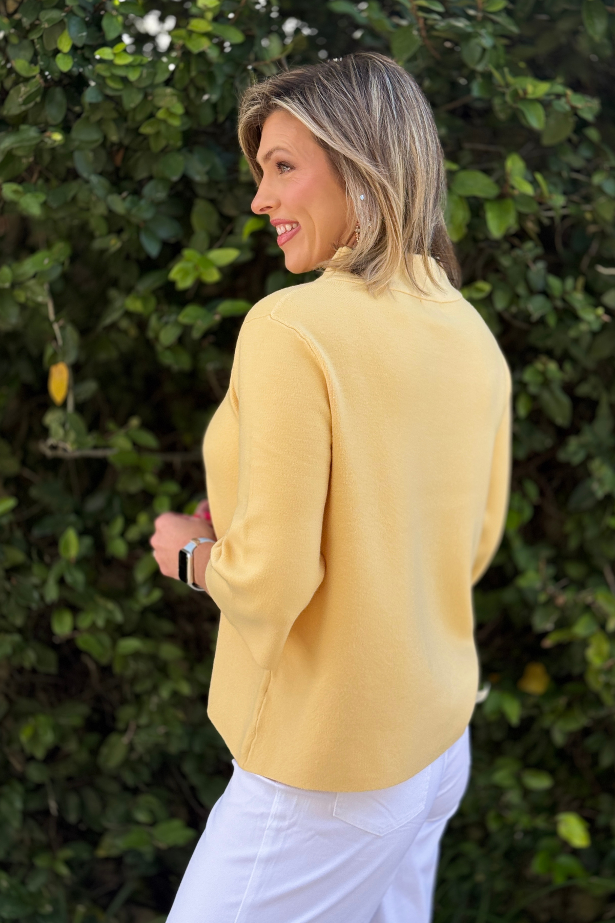Bright yellow lightweight knit sweater with modern bell sleeves