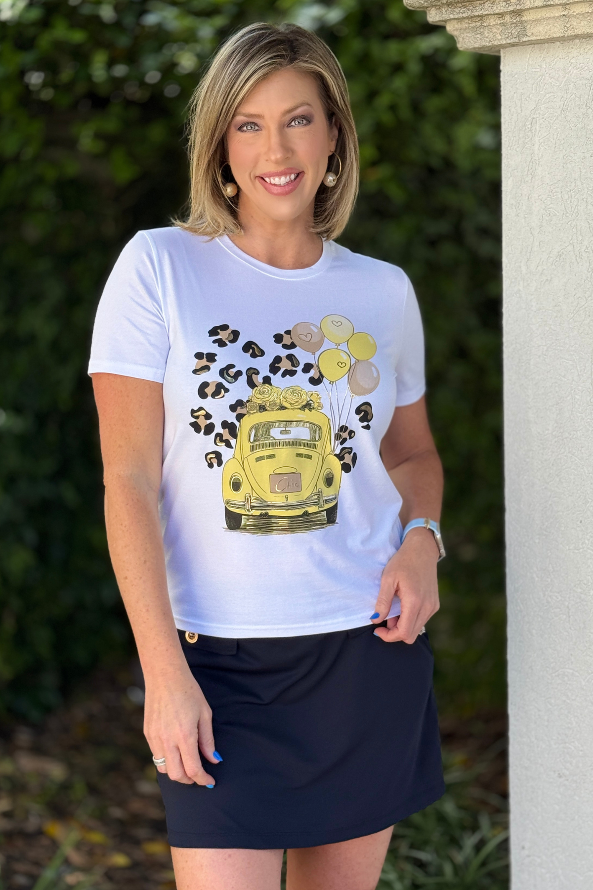 white graphic tee with gold car print