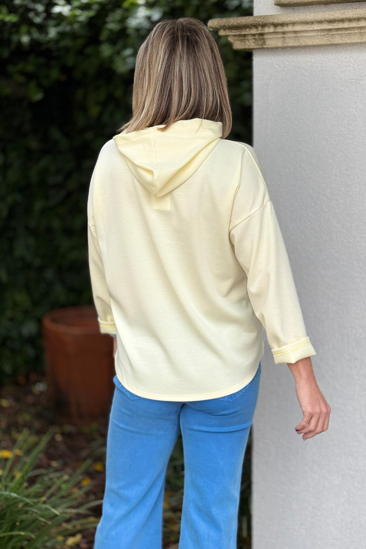 Casual spring outfit with lightweight hoodie and denim styling