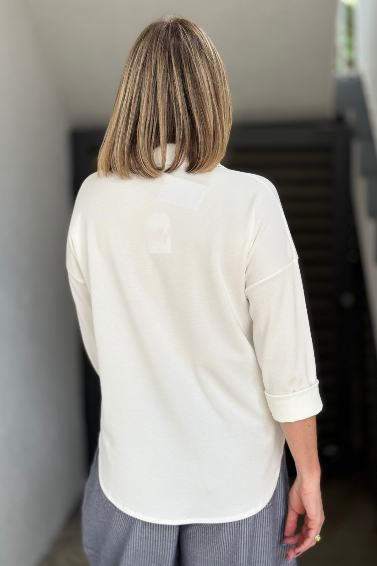 women’s soft collared blouse with buttons and front pocket detail