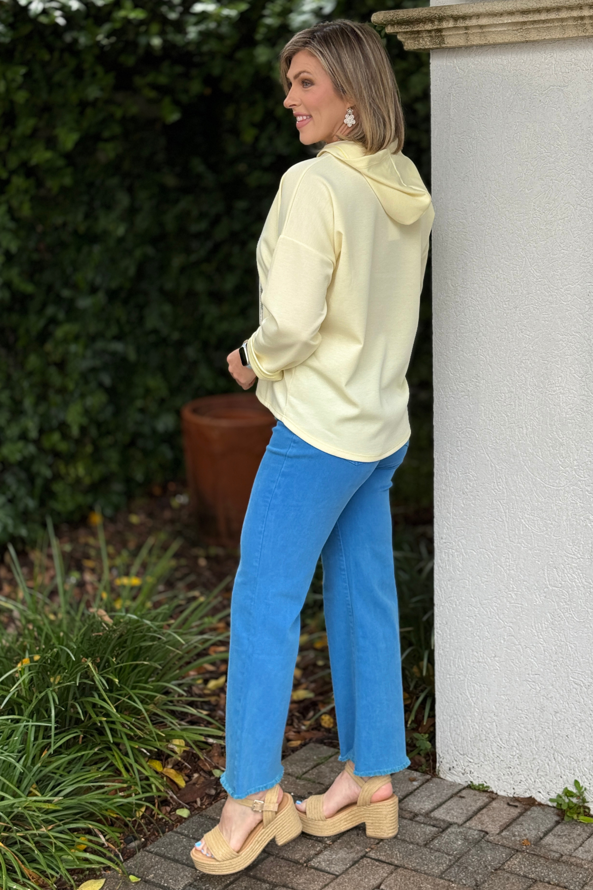 Close up of sneaker graphic print on boutique hoodie top