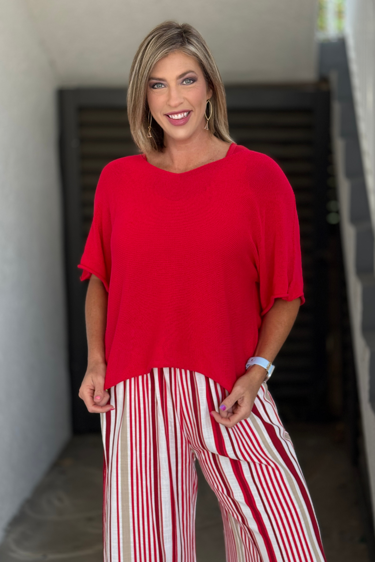 Red sheer knit top with relaxed sleeves
