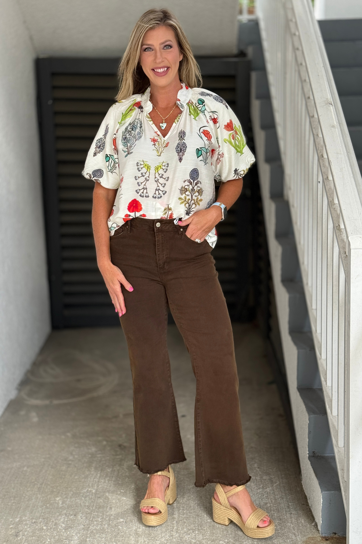 Side view of The Essential Wide Leg Jeans in Espresso featuring a flattering wide leg cut, soft stretch denim, and raw edge hem for effortless fall style.