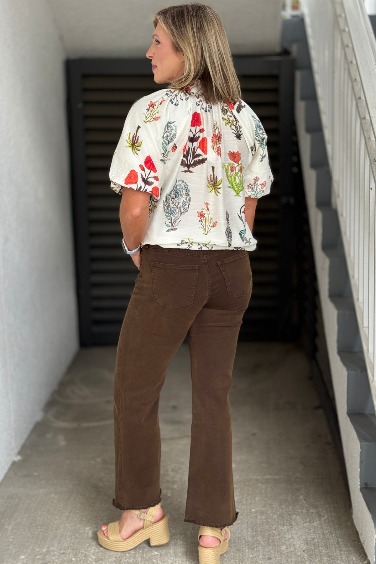 Close-up of The Essential Wide Leg Jeans in Espresso highlighting the high-rise waistband, button closure, zipper fly, and rich espresso wash.