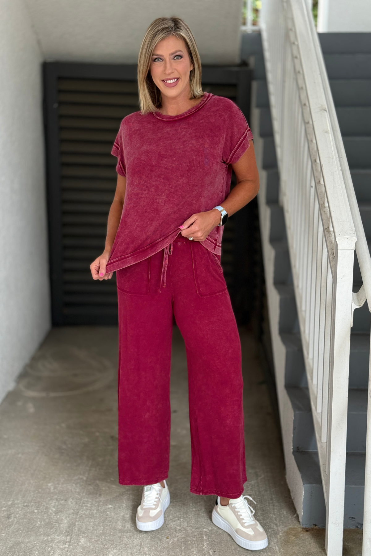 Side view of the Cabernet mineral wash lounge set featuring relaxed short sleeve top and wide leg pants.