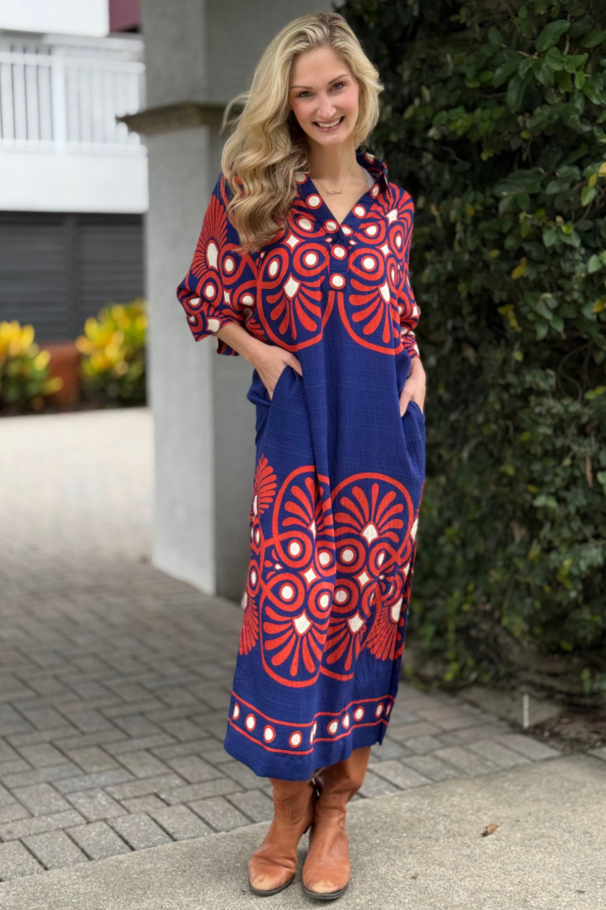 front view of The Retro Bloom Midi Dress featuring notch collar and side pockets