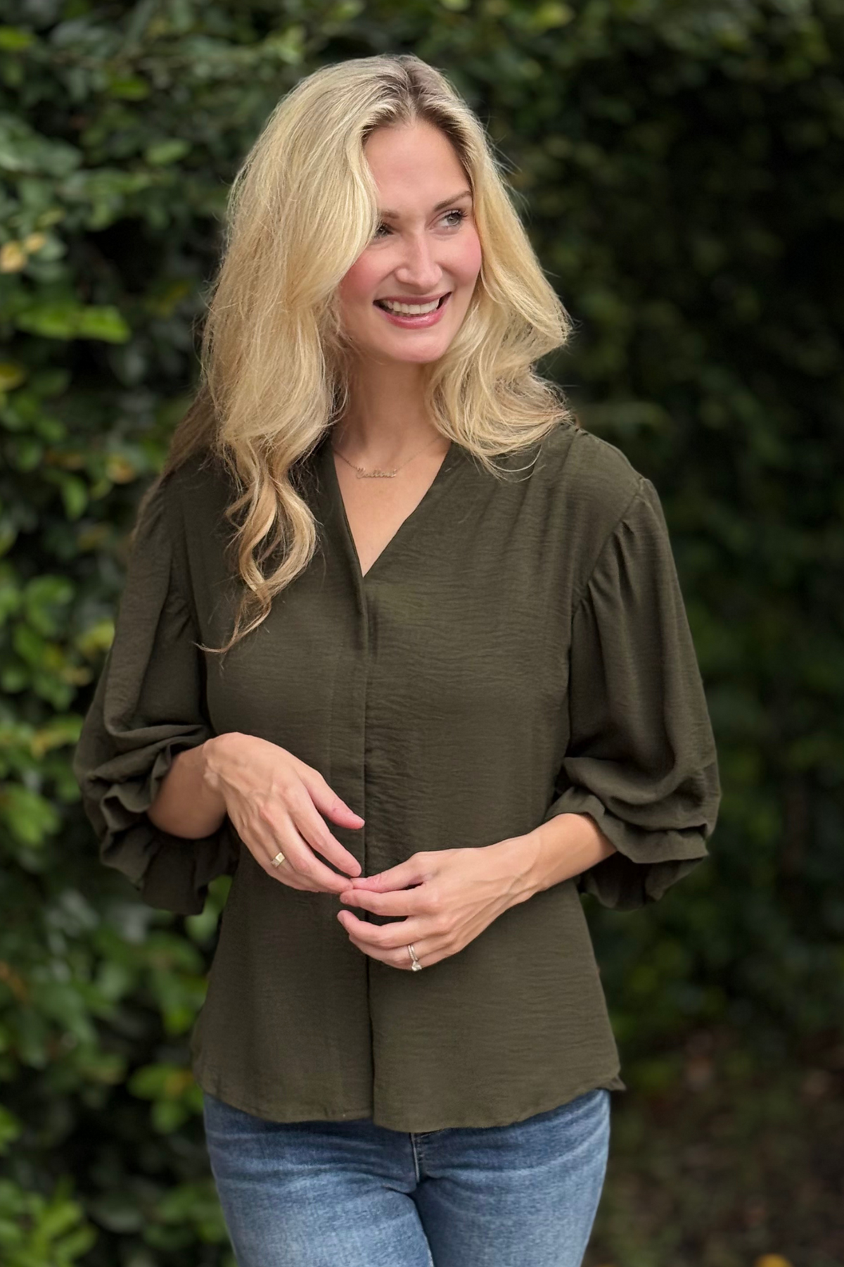 Elegant balloon sleeve blouse styled with denim – front view