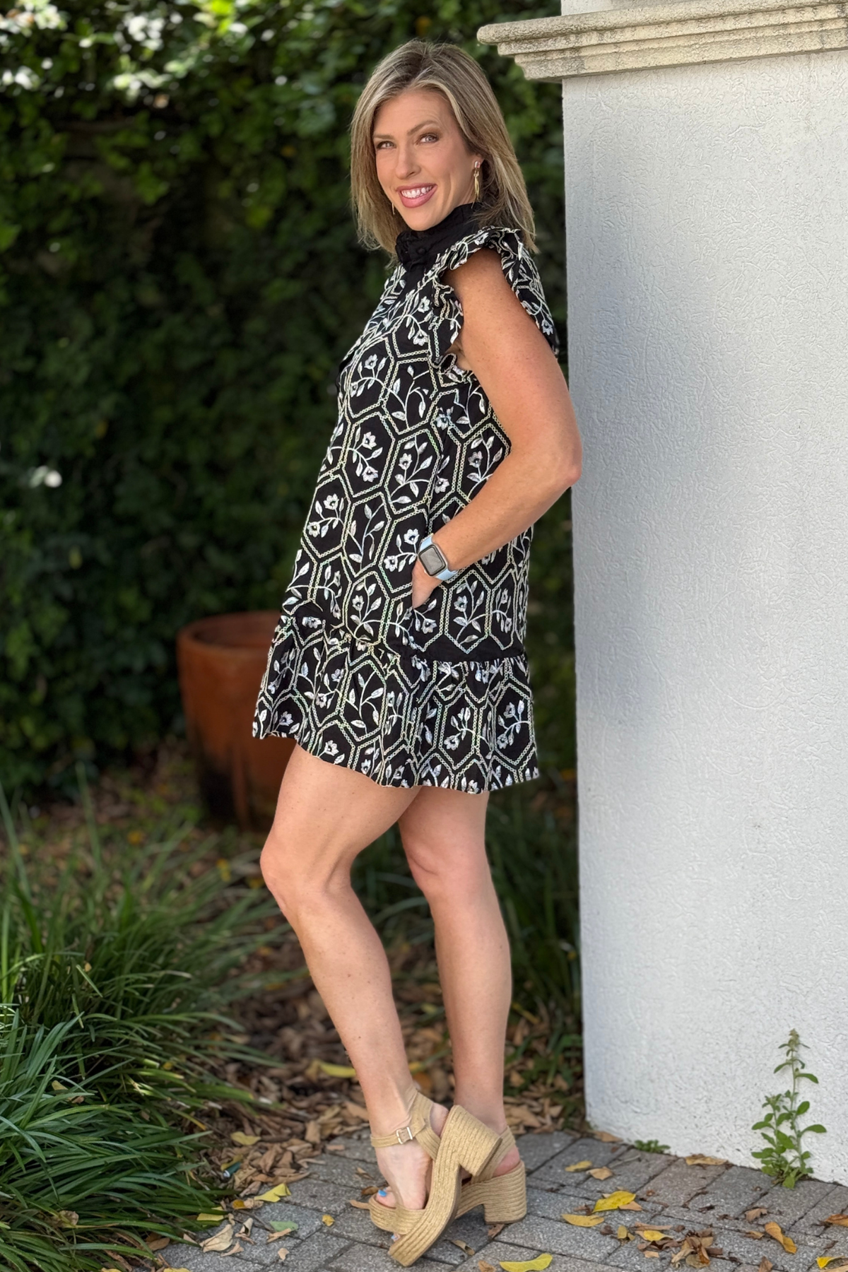 women’s boutique black dress with white embroidery detail