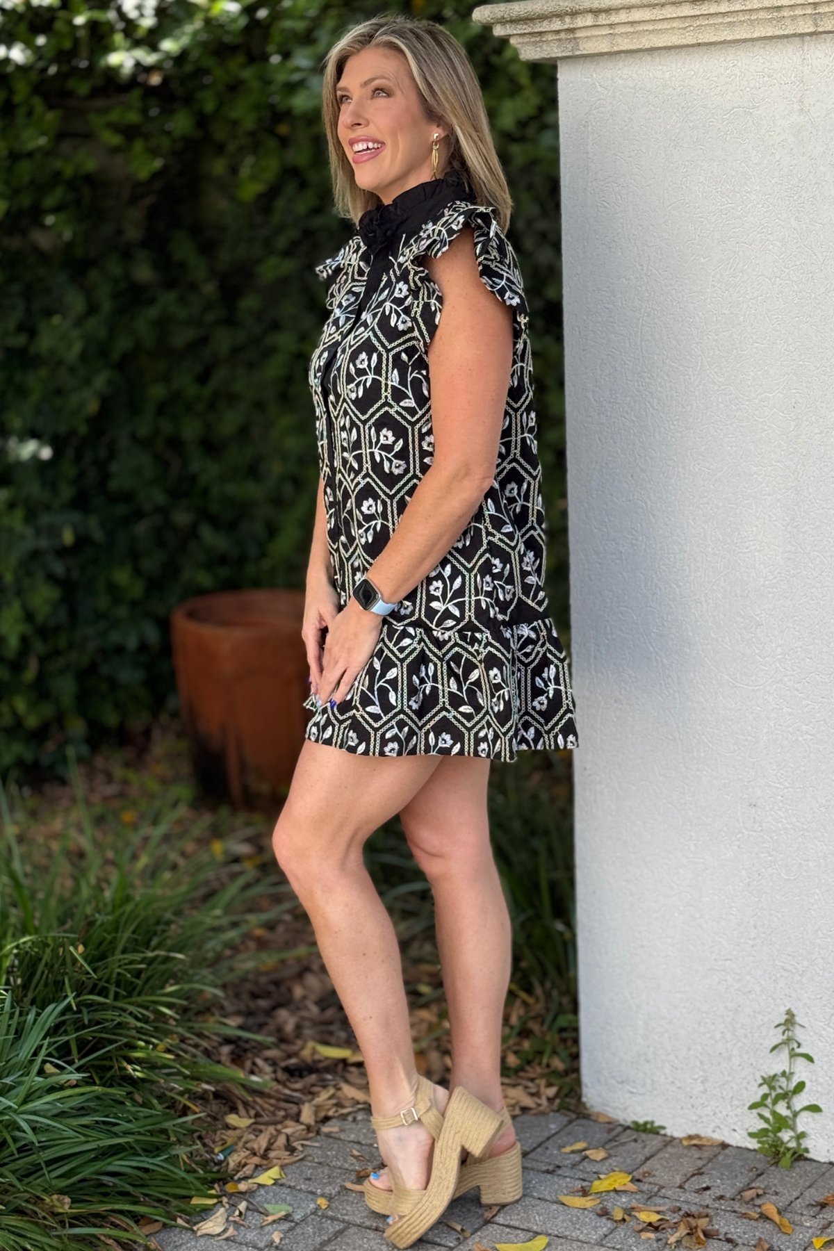 lined black dress with ruffle hem and collar
