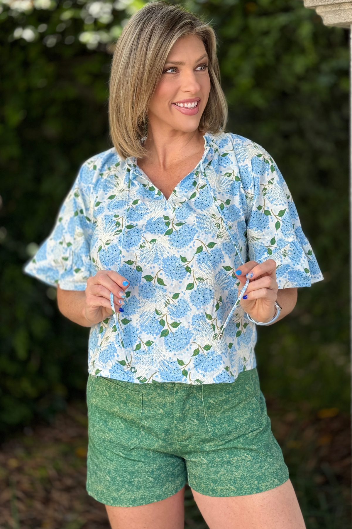 blue floral embroidered ruffle sleeve top with beaded tie