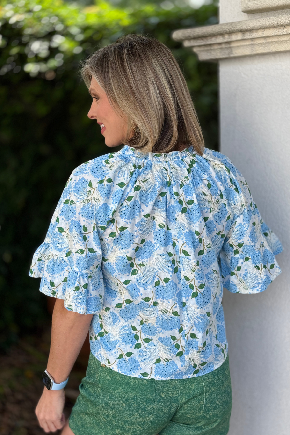 embroidered floral top with v neckline and ruffle detail