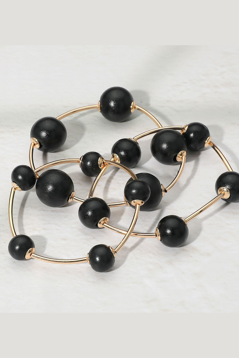 Chunky black bead multi-layer stretch bracelet with gold accents