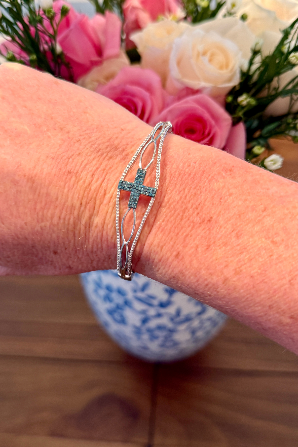 Faith cross bracelet with blue stones and snap clasp