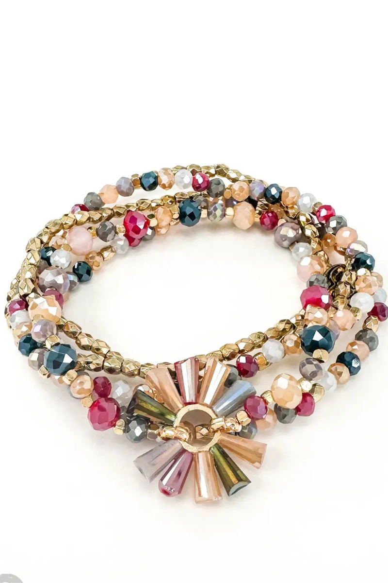 Four strand colorful beaded bracelet with fluted center detail