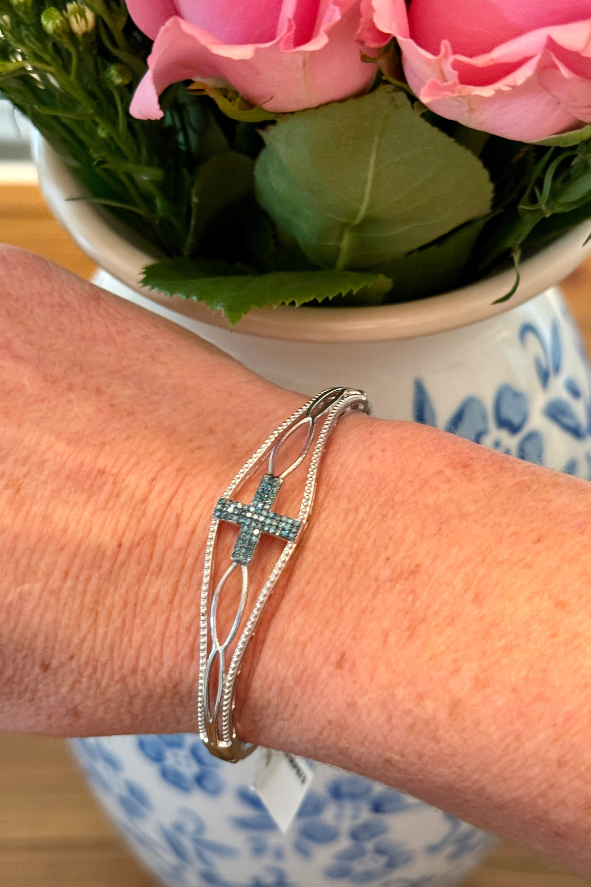 Sterling silver bangle bracelet with blue diamond and moissanite cross