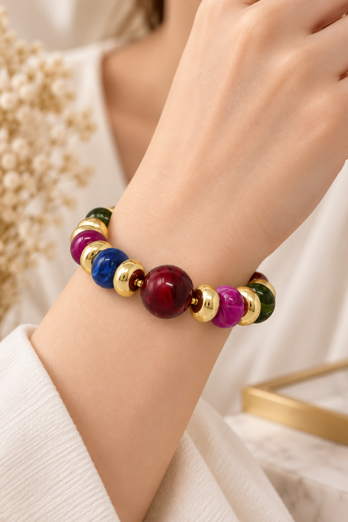 Chunky resin beaded stretch bracelet with jewel tone beads and gold accents