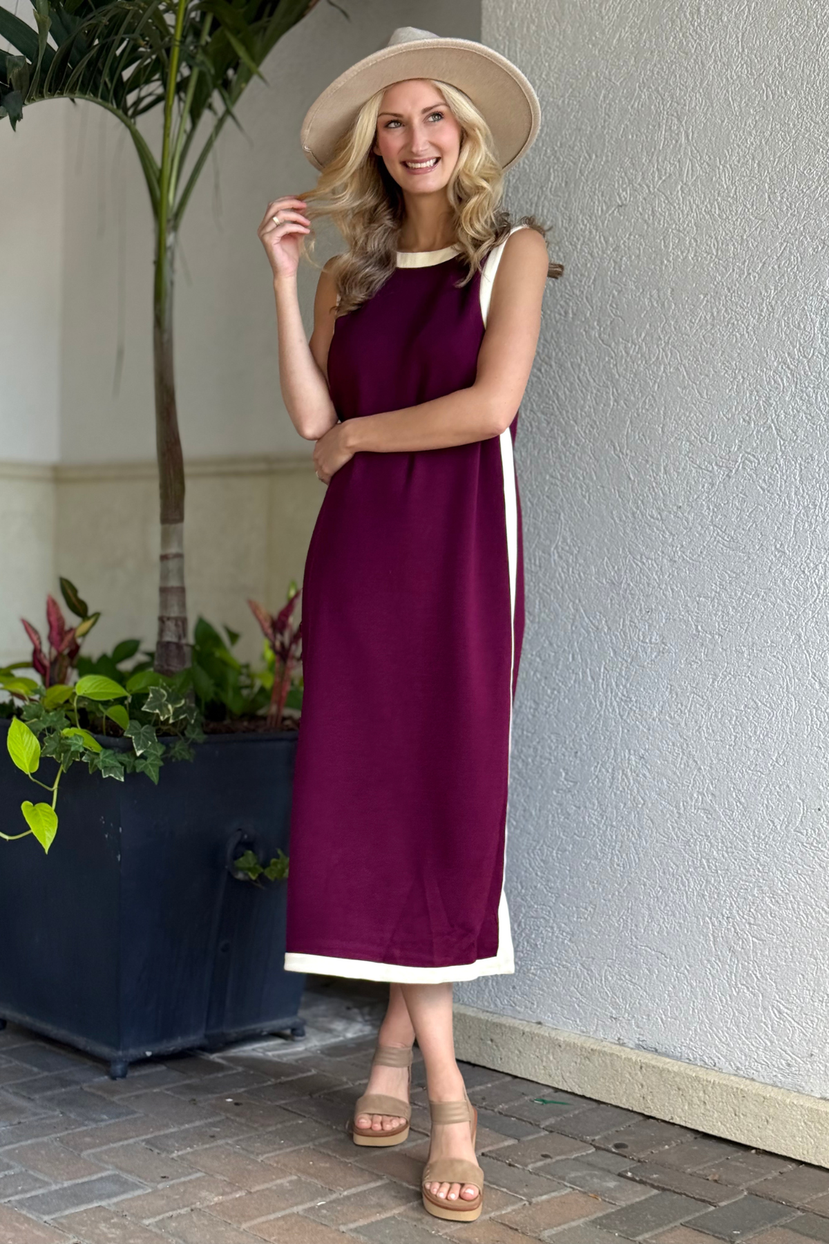 Woman wearing The Bordeaux Bound Midi Dress in burgundy with cream trim from The Pink Nickel