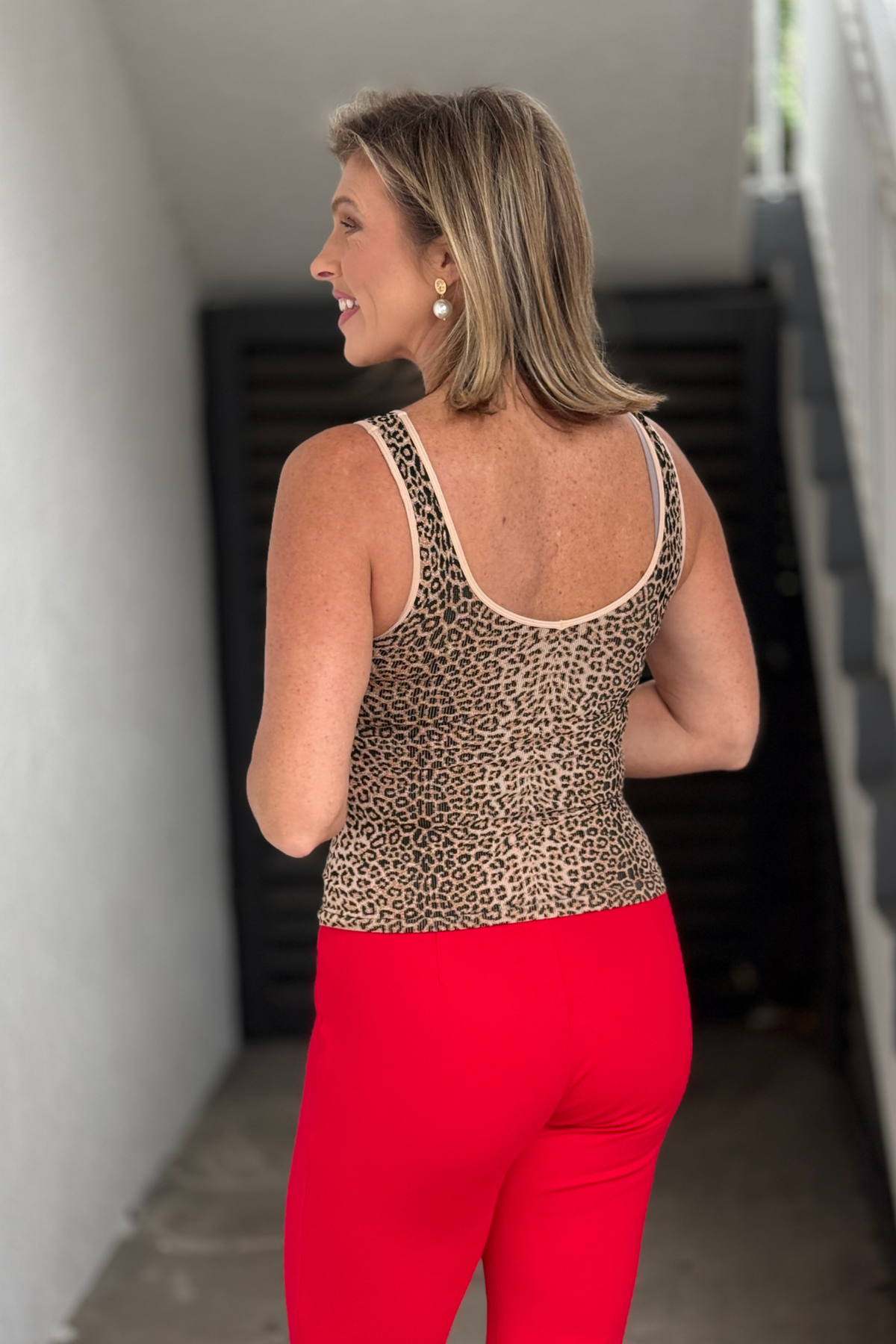 Stretchy leopard print tank styled with red pants