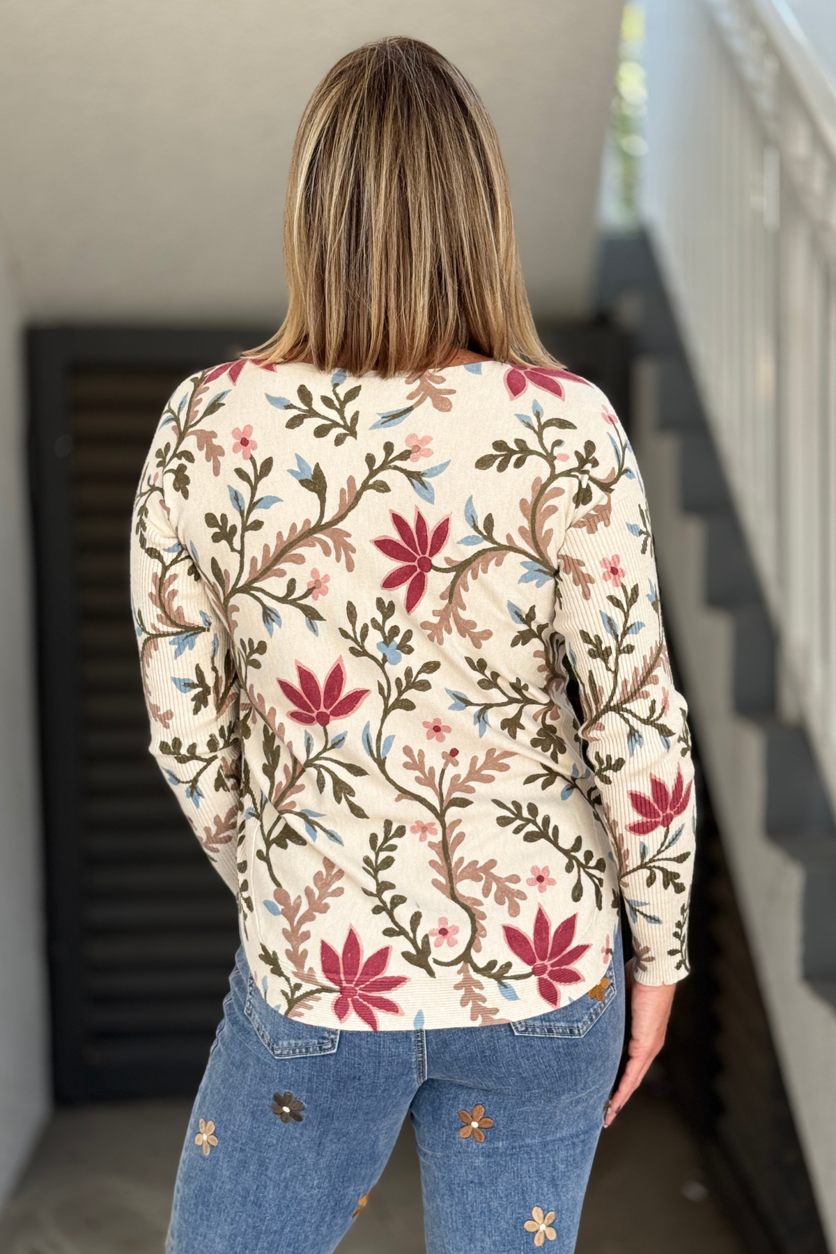 Back view of Charlie B floral print sweater