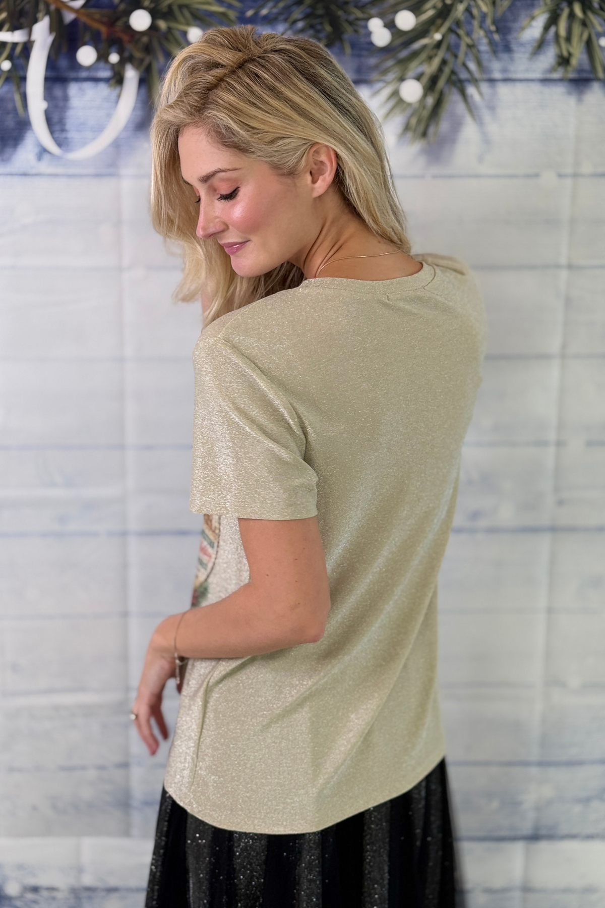 Sparkly western Christmas graphic tee styled with black skirt