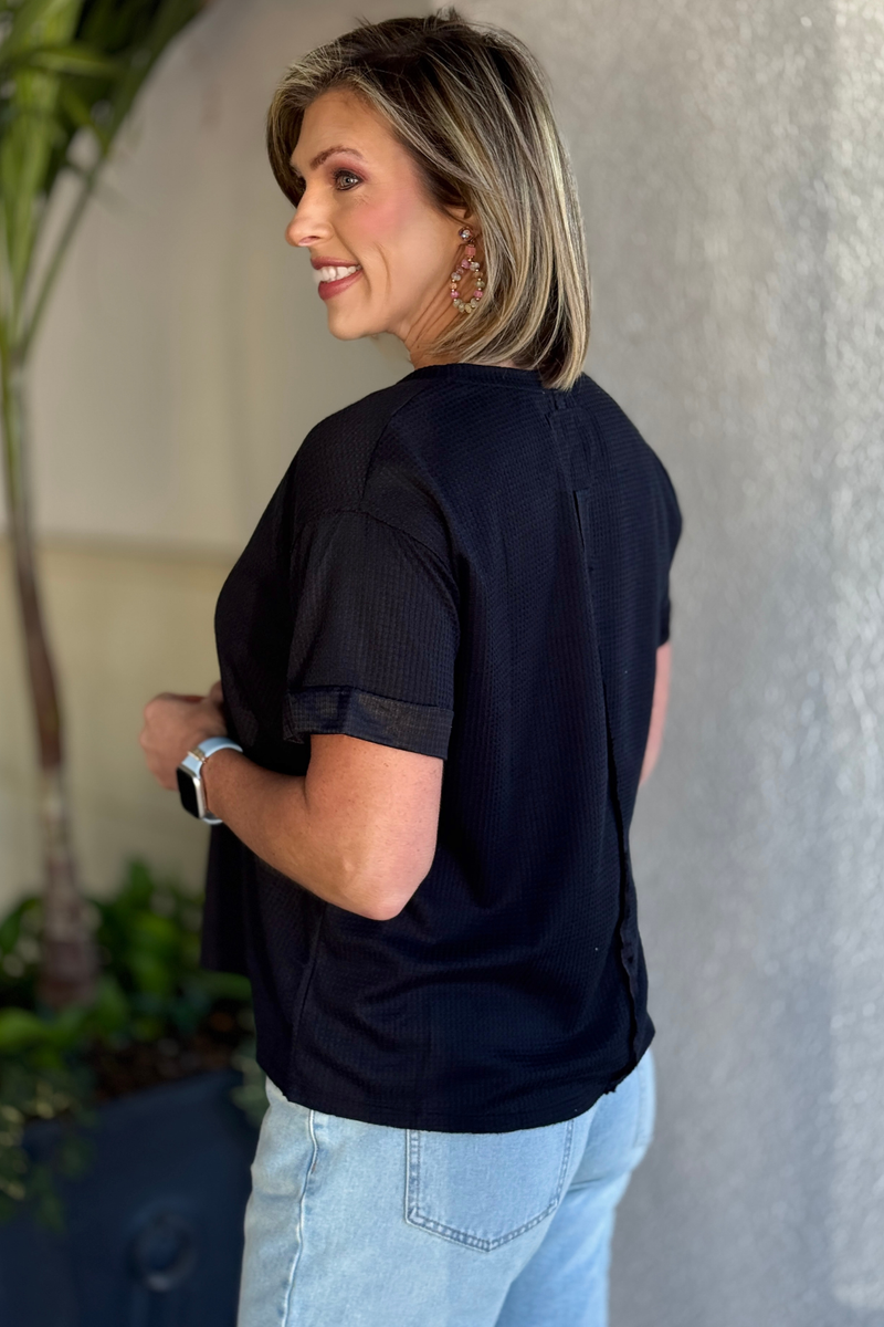 Front view of short sleeve thermal knit top with relaxed fit