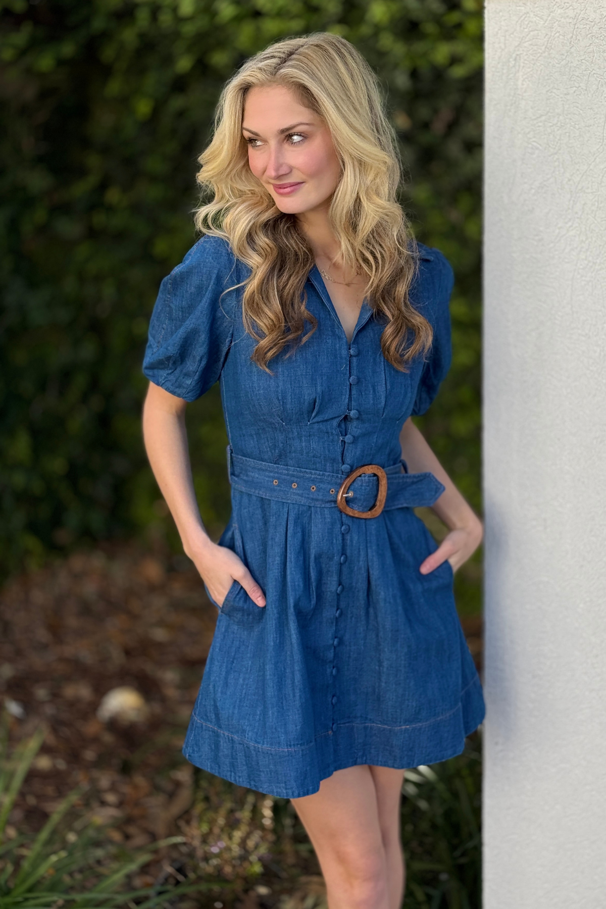 Close up of puff sleeve pleated detail on denim dress