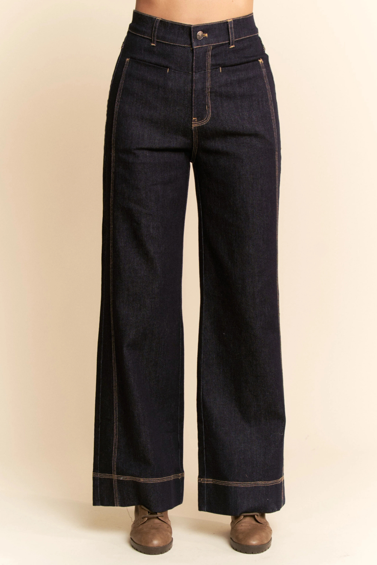 Women’s dark denim wide-leg pants styled with sweater