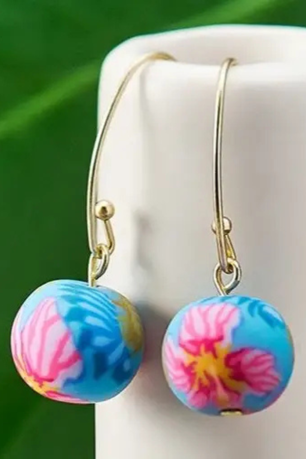 Paradise Island Medium Bead Earrings featuring colorful handcrafted polymer clay beads with tropical floral designs and matte gold fish hook ear wires.