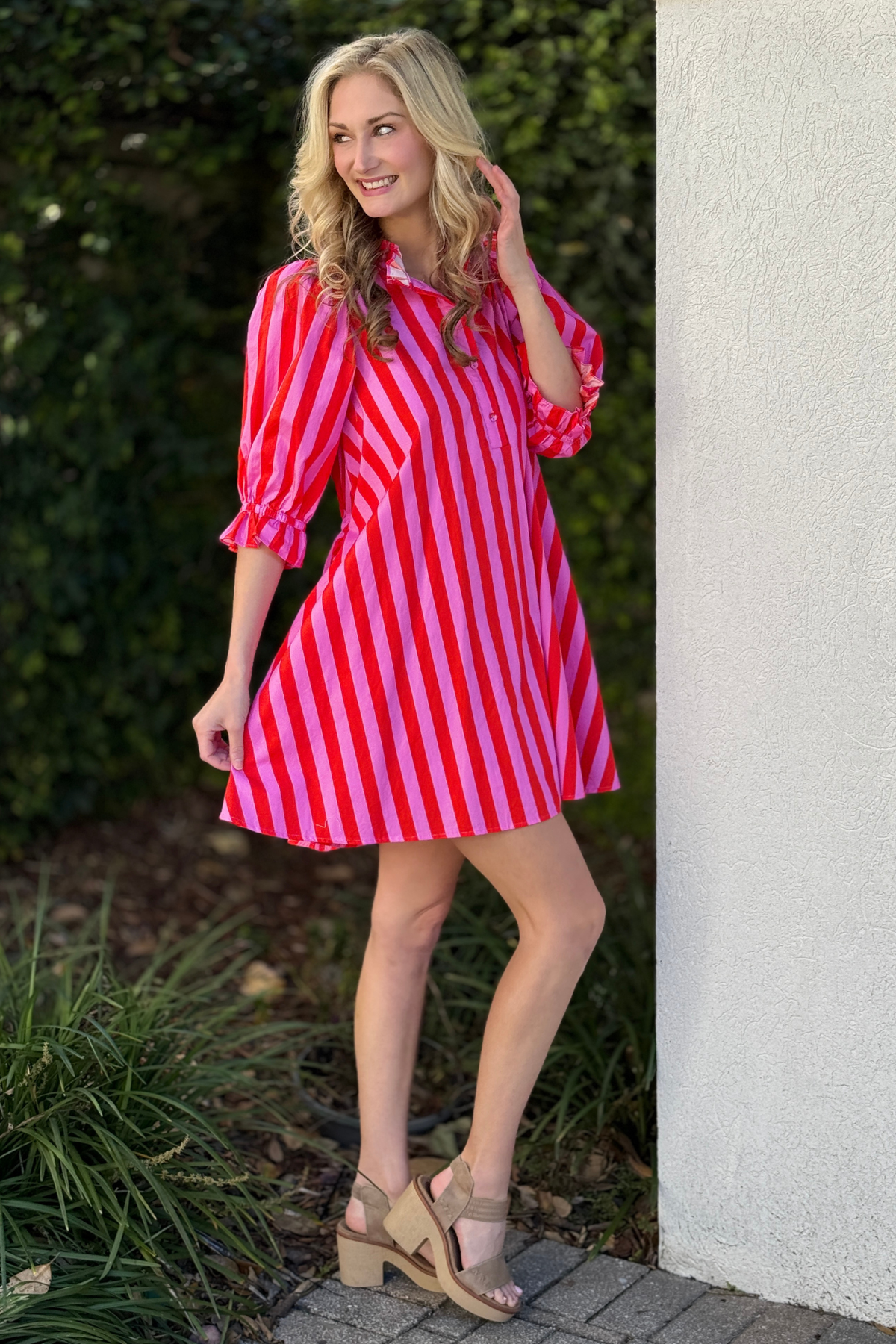 Back view of striped mini dress with adjustable self-tie waist