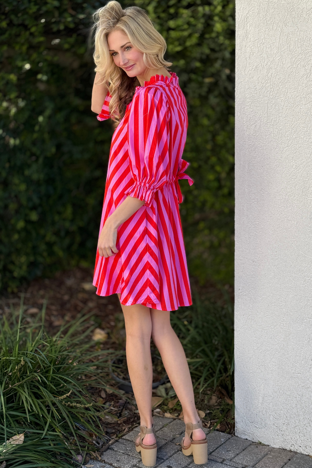 Spring pink striped mini dress styled for warm weather
