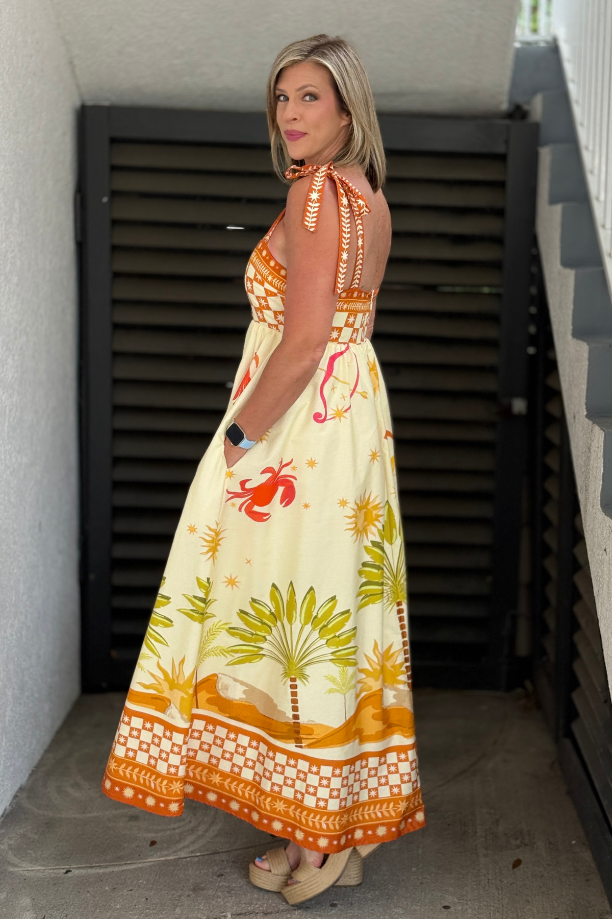 Ivory and orange vacation maxi dress with adjustable shoulder ties