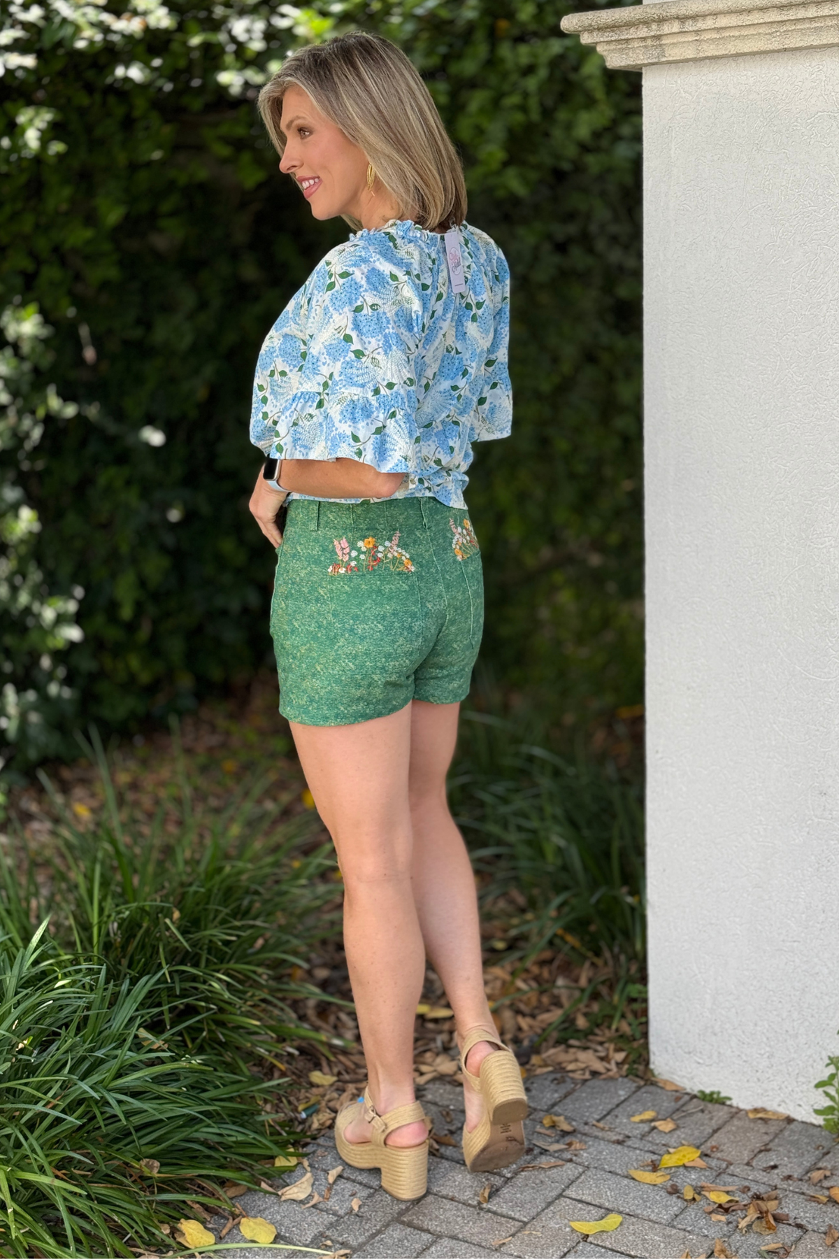 high waisted green shorts with button front and patch pockets