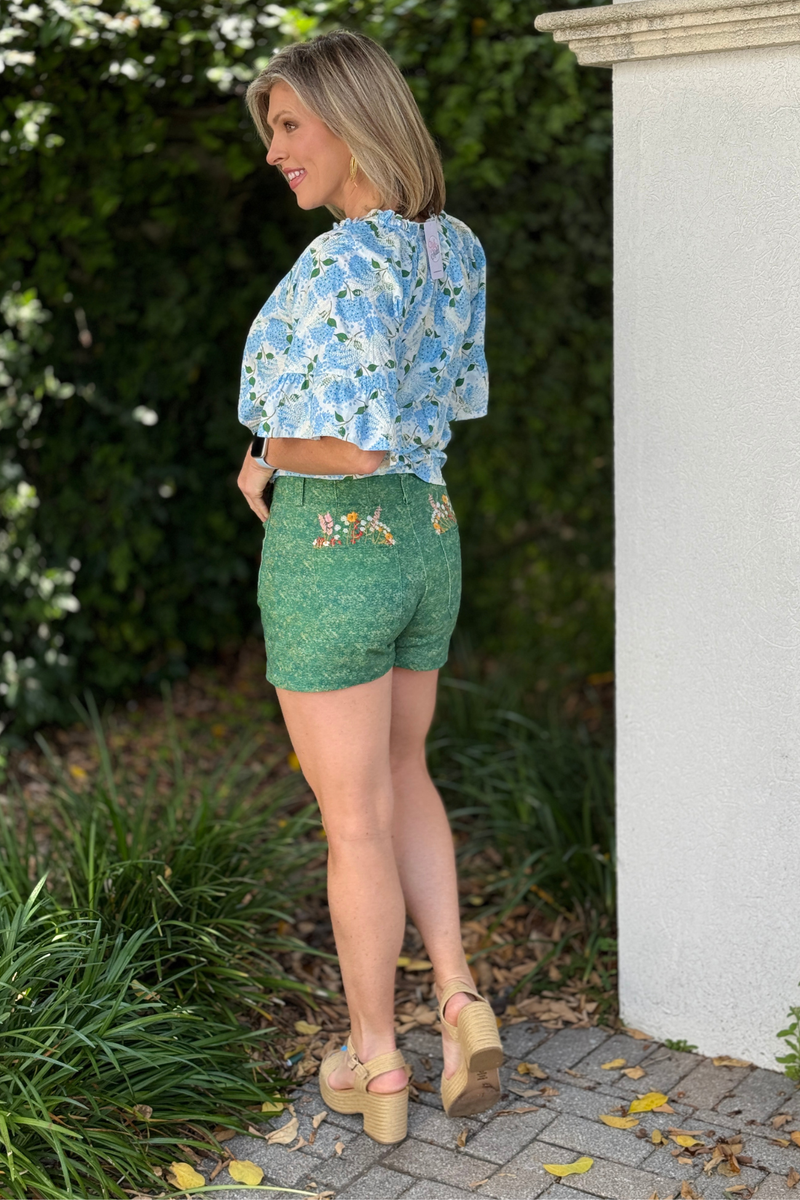 high waisted green shorts with button front and patch pockets