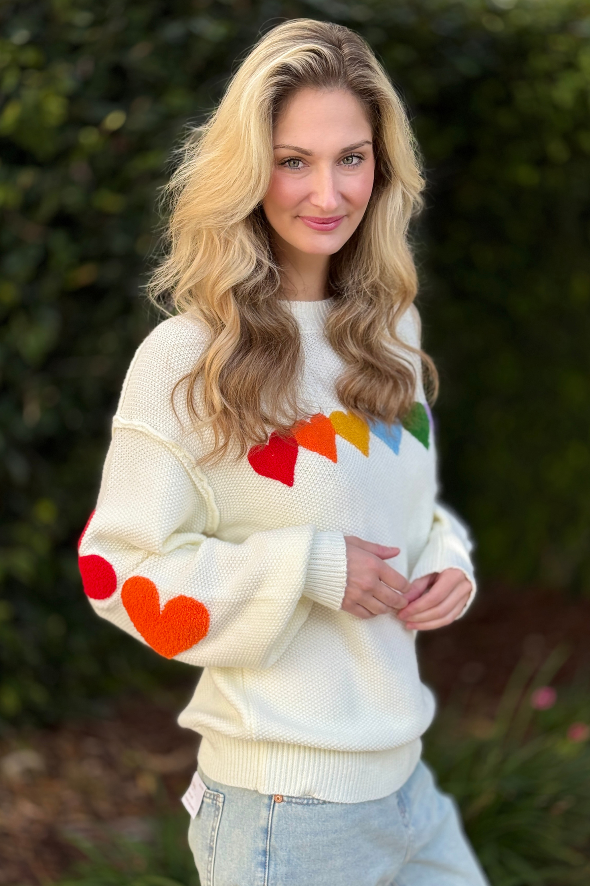 Side view of sweetheart heart knit sweater