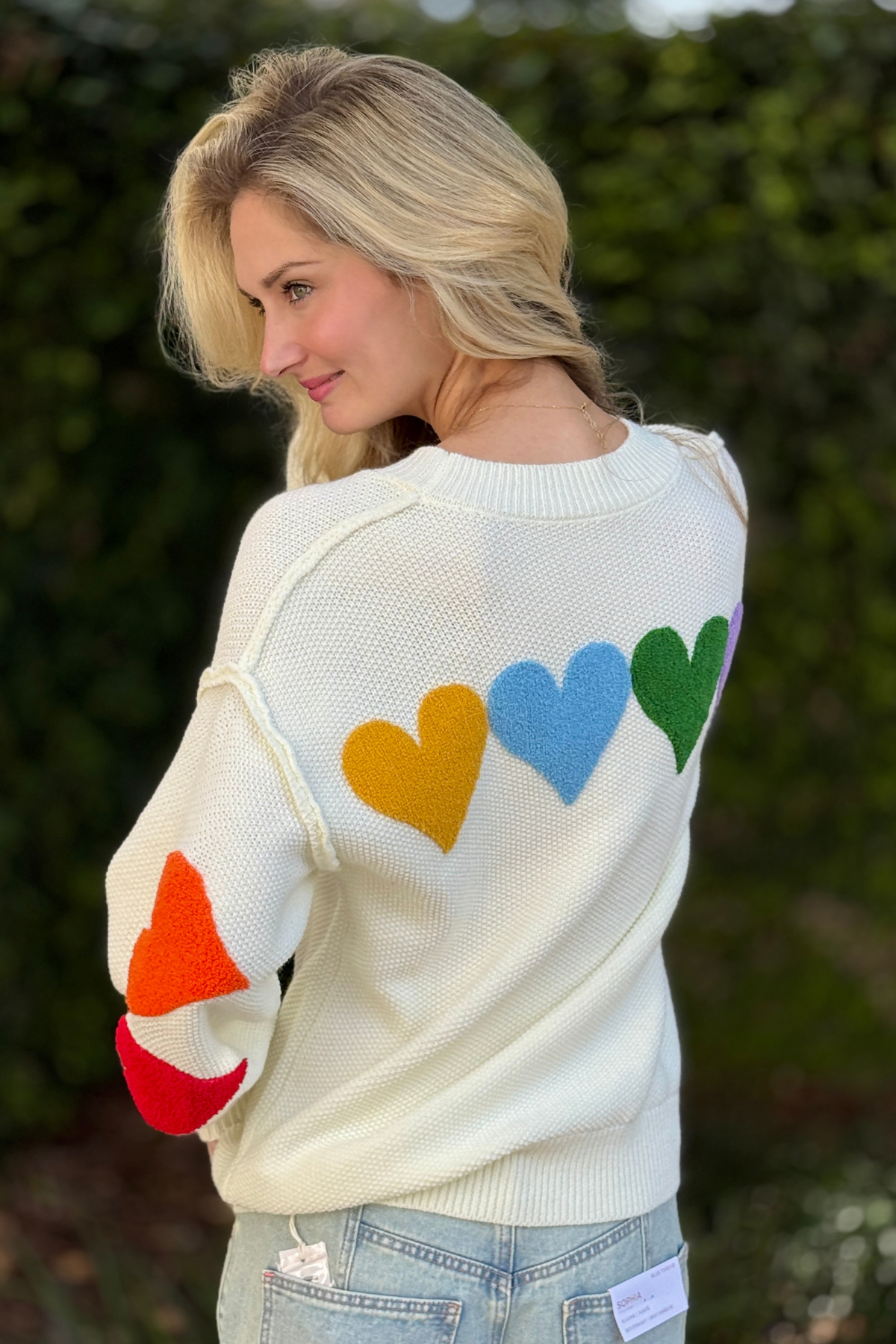 Back view of heart stitched sweater