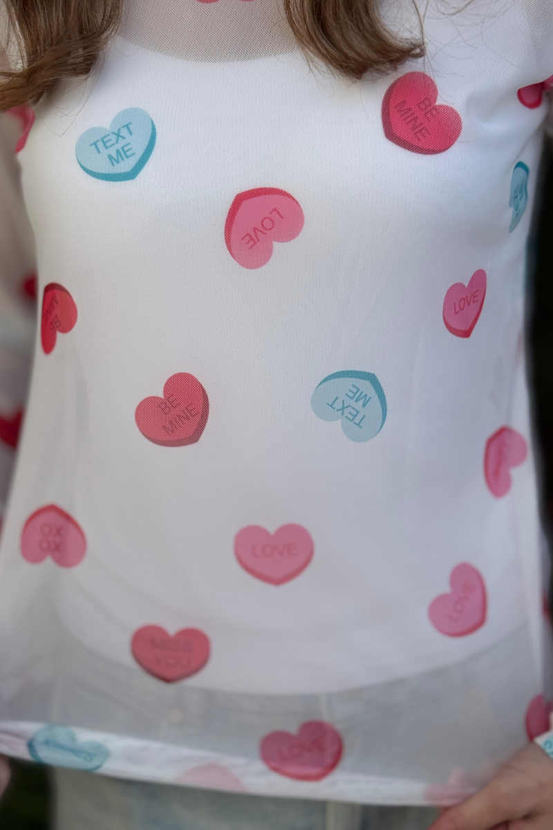 Valentine heart mesh top styled under sweater