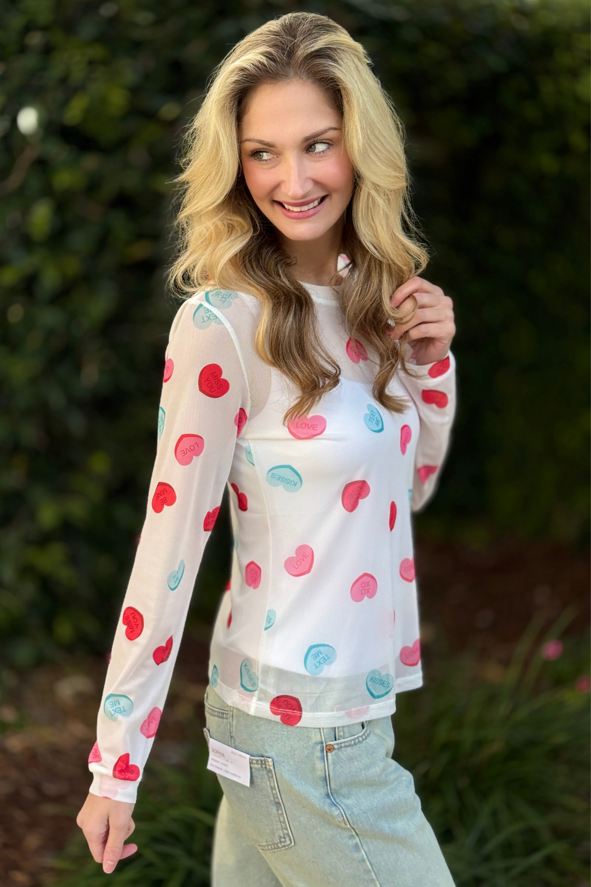 Close up of heart and love print mesh fabric