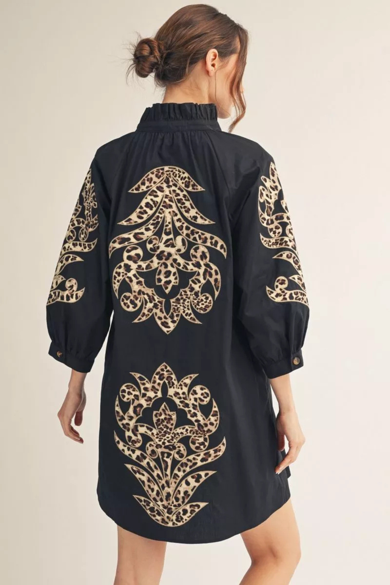 Back view of black leopard contrast shift dress