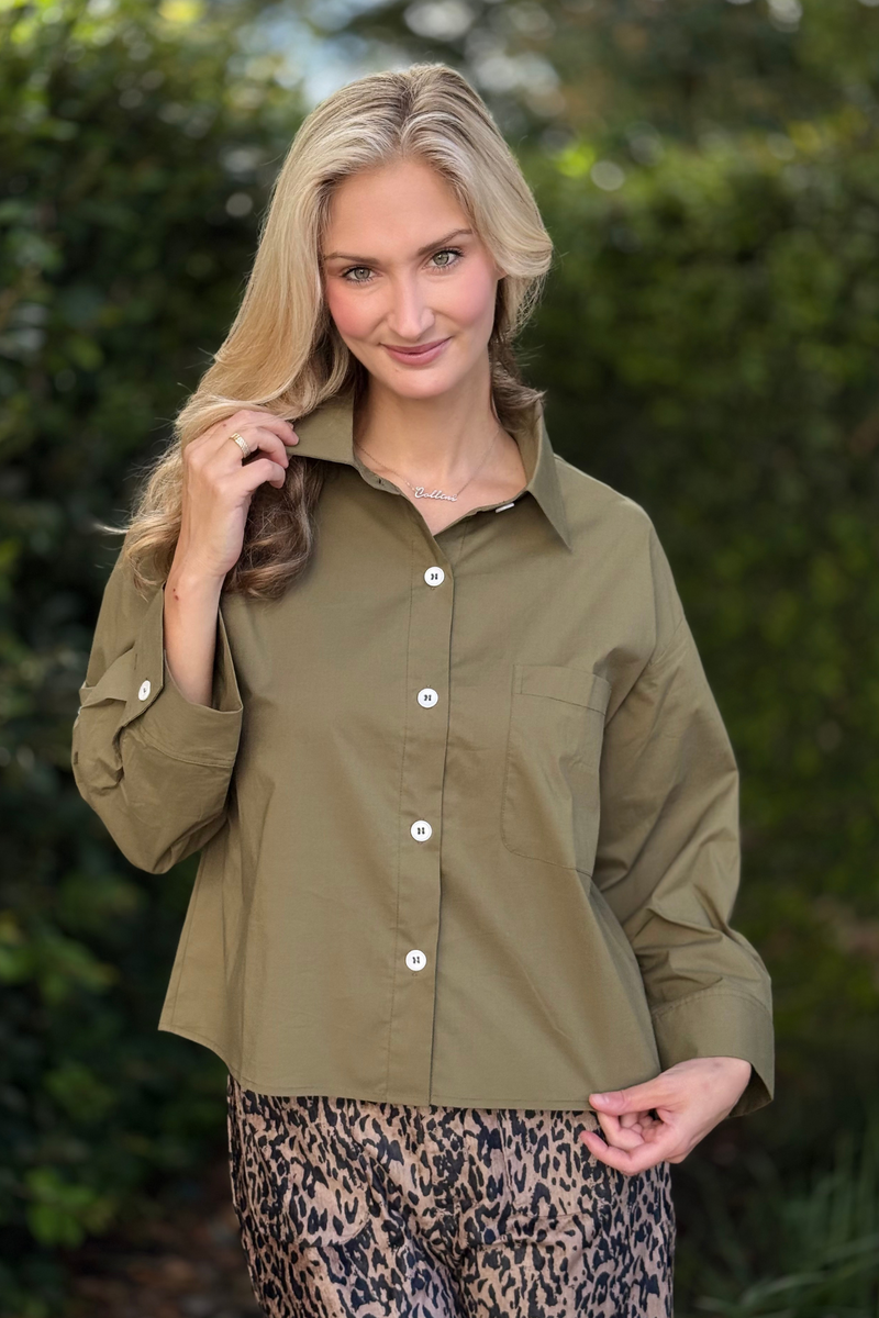 Women’s olive green button front shirt with roll-up sleeves